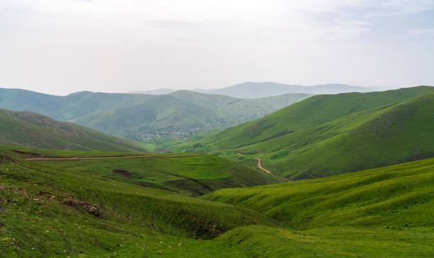 istock Mountain landscape covered with green grass 1494726342