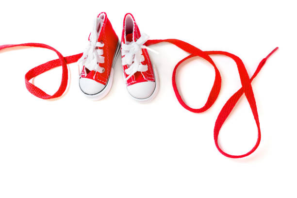 Word Love Made From Tiny Red Sneakers and a Lace