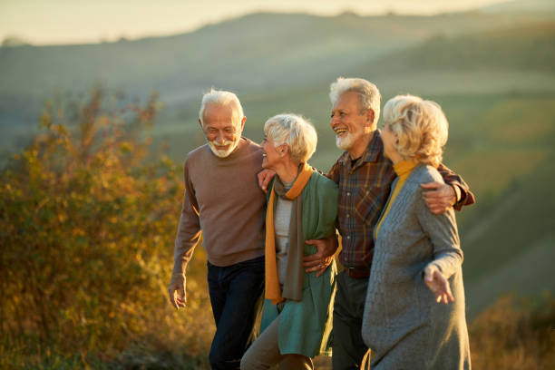 istock Happy senior friends talking in autumn day. 1494738945