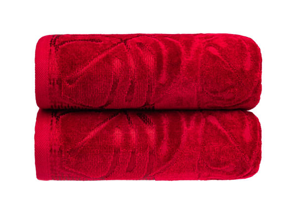 istock multicolored terry towels, rolled up and stacked on the table 1494741012