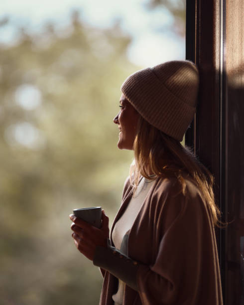istock Happy woman day dreaming while enjoying in her coffee time. 1494741636