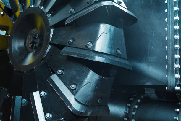 Wheel with buckets of a large, dredging vessel, close-up.