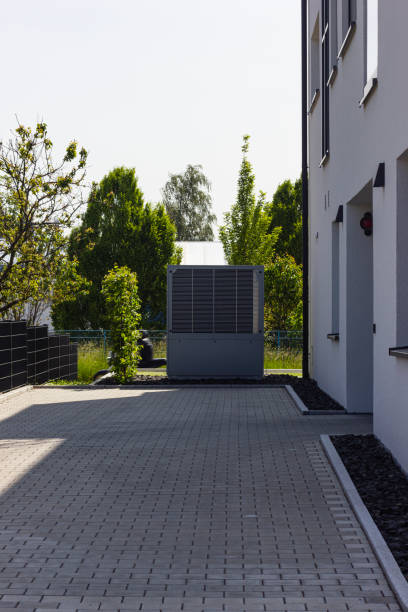 heat pump in a new building area with modern house facades stock photo