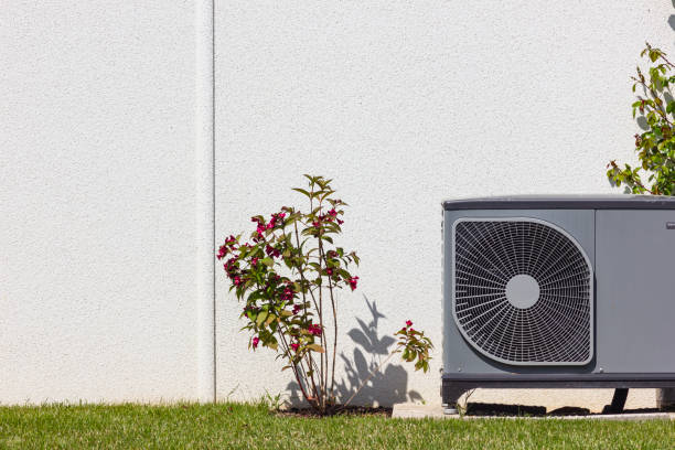 heat pump in a new building area with modern house facades stock photo