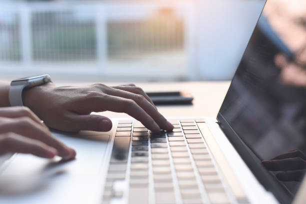 istock Woman hand typing on keyboard, online working on laptop computer 1494745071
