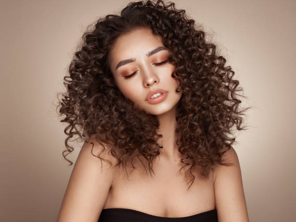 istock Beautiful smiling woman with afro curls 1494745331