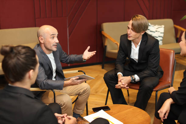 istock Collaborative process of multiethnic business people team working together discussing, researching, brainstorming and planning work at business meeting workplace in modern office building 1494747033