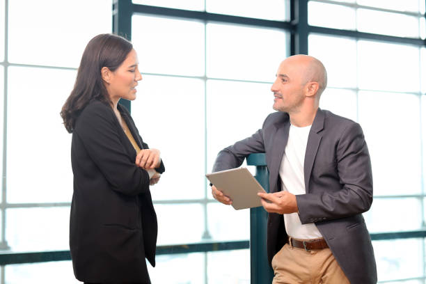 istock Collaborative process of multiethnic business people team working together discussing, researching, brainstorming and planning work at business meeting workplace in modern office building 1494747043