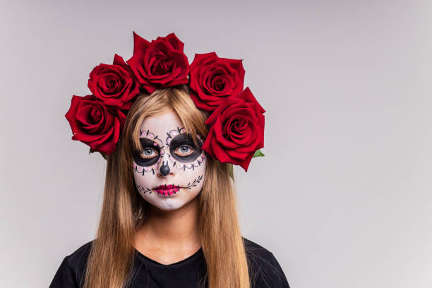 istock girl with painted face looking at camera in studio and ready to party 1494748509