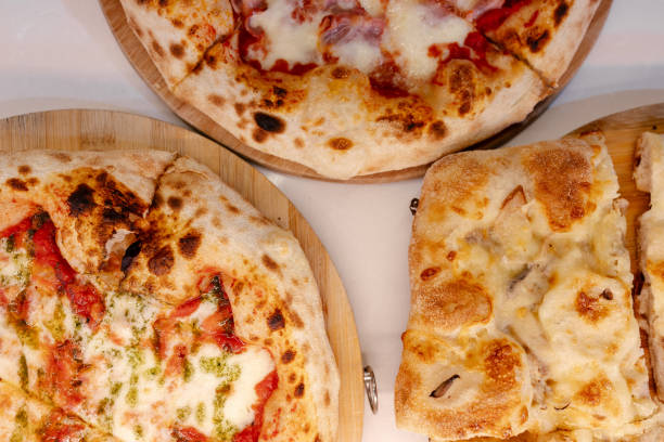 istock Overhead portrait of several pizzas 1494749255