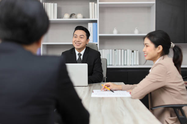 istock Collaborative process of professional businesspeople going over on new project together, using computer presentation and brainstorming ideas, coworker and working together at office meeting concept 1494750215