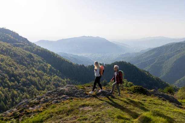istock Mature couple explore mountain meadow in morning light 1494754965