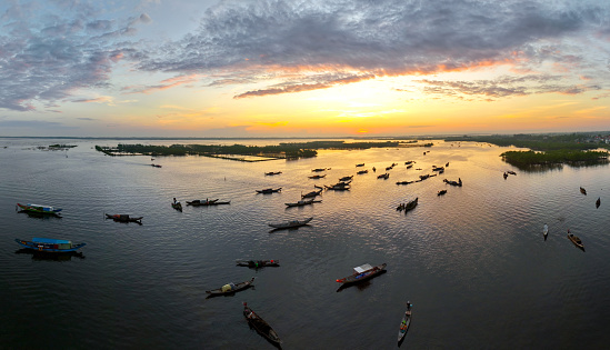 Floating market on Tam Giang lagoon under the sunrise, Thua Thien Hue province