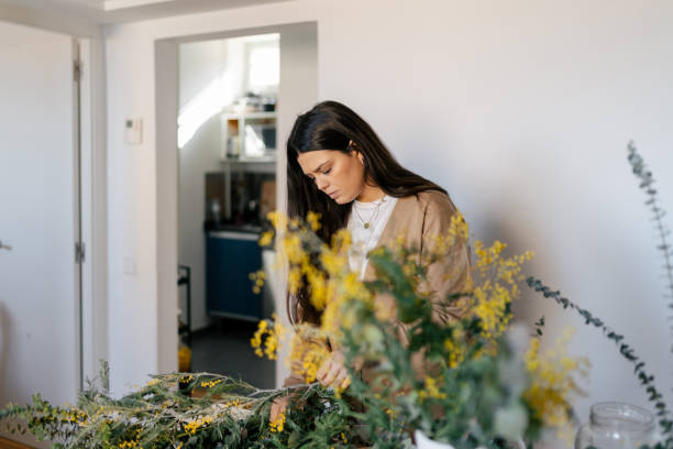 istock Young woman working on flowers 1494755526
