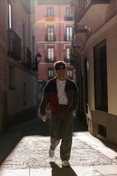 istock Young man walking in the city 1494759323