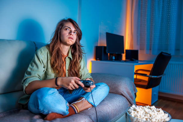 istock Woman playing video games disappointed after losing 1494759364