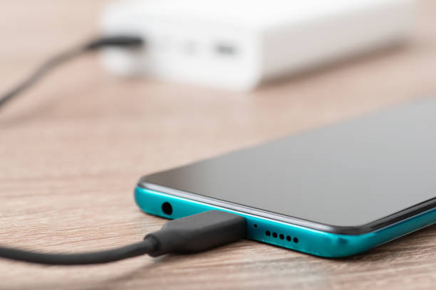 istock Charging phone via usb cable, powerbank on the background 1494760234