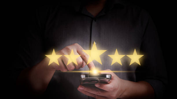 istock Close up man hand using smart phone and give five star symbol 1494762947