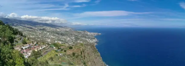 Madeira Island Portugal - 04 21 2023: Full panoramic aerial view of the city of Funchal and Camara de Lobos, tourist and iconic city on the island of Madeira, in Portugal