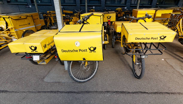 german post bicycles - deutsche post ag package germany occupation imagens e fotografias de stock