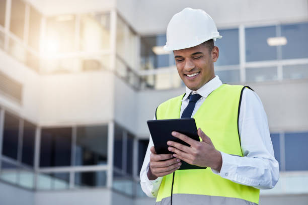 istock Engineering, digital tablet and man construction worker on outdoor building site in the city. Happy, smile and male industry worker or contractor working on a mobile device for maintenance management 1494765649