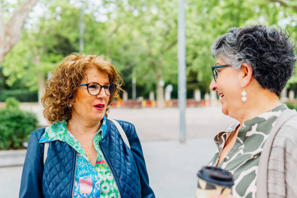istock Mature friends chatting while drinking coffee in the street 1494766925