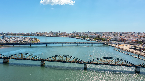 Portuguese bridges over the river Arade overlooking the city of Portimao. Ponte Velha. High quality photo