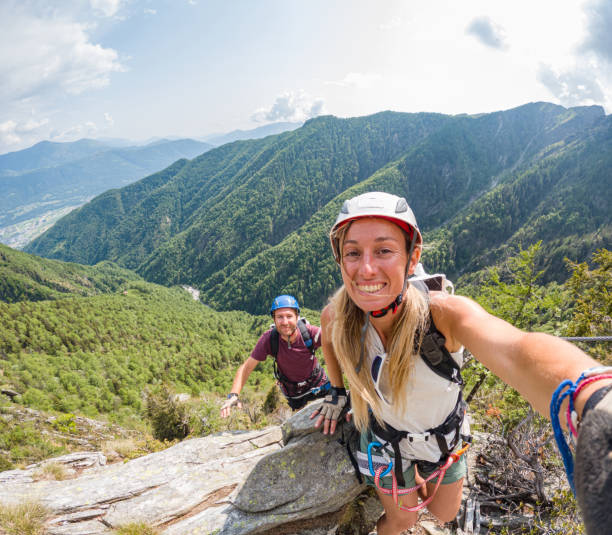 istock Couple taking selfie during rock climb activity 1494770110