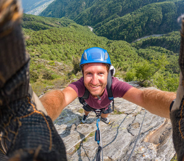 istock Rock climber takes cool selfie on mountain route 1494770334