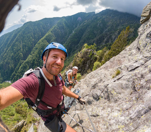 istock Couple taking selfie during rock climb activity 1494770380