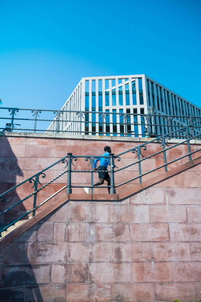 istock young sportsman running up steps outdoors in berlin 1494772897