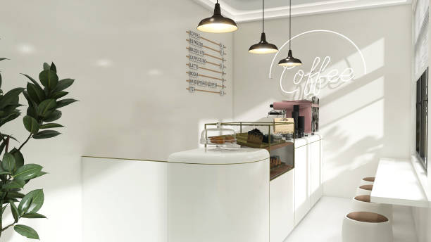 istock Small modern Korean style design cafe, glossy ivory white counter, cake display, professional espresso machine, bar table, stool chair with brown cushion in sunlight from window blinds 1494775371
