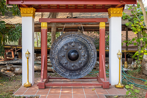 Wat Xiengthong, Luang Prabang, Laos - March 15th 2023: The gong is a important object in all Buddhist temples, this is from one of the many small public temples in the former capital of Laos