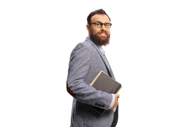 istock Bearded man with glasses holding books and smiling 1494781680