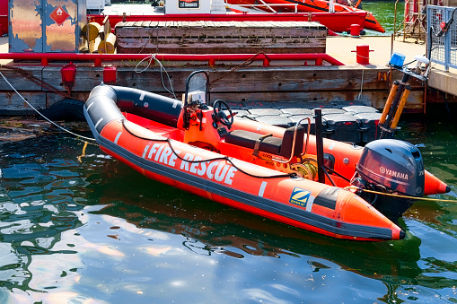 Toronto, Canada - May 21, 2023: A fire brigade inflatable rescue boat on Lake Ontario on a sunny day. No people are on the scene.