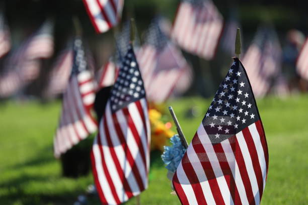 istock American Flags Flying on Veterans Cemetery 1494782829