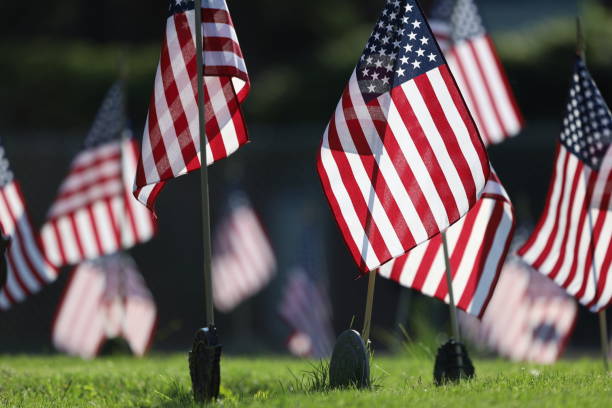 istock American Flags Flying on Veterans Cemetery 1494782853