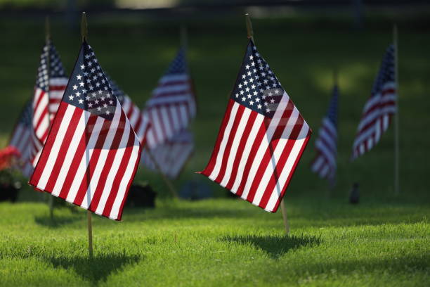 Memorial Day Ceremony, American Flags Flying on Veterans Cemetery.