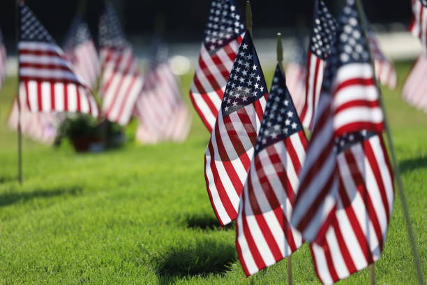 istock American Flags Flying on Veterans Cemetery 1494782934
