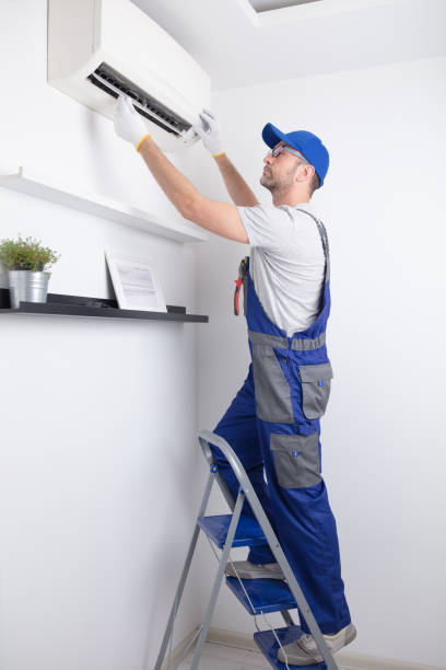 istock Service guy cleaning and maintaining air condition unit. 1494784260