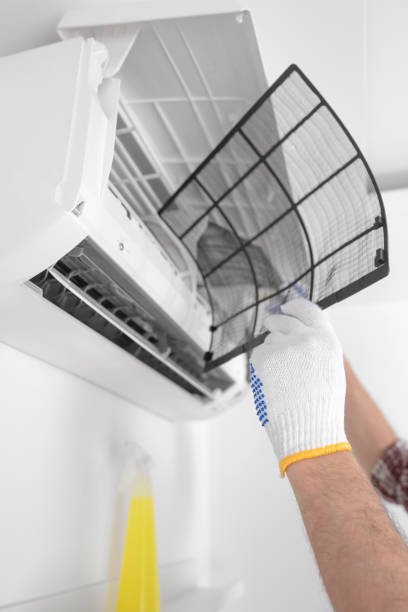 istock Service guy cleaning and maintaining air condition unit. 1494784864