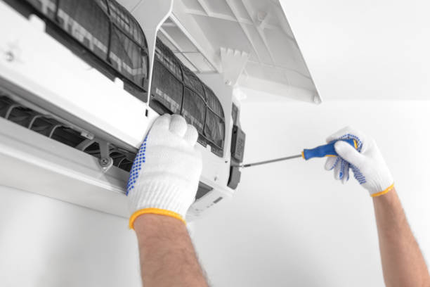 istock Service guy cleaning and maintaining air condition unit. 1494785485