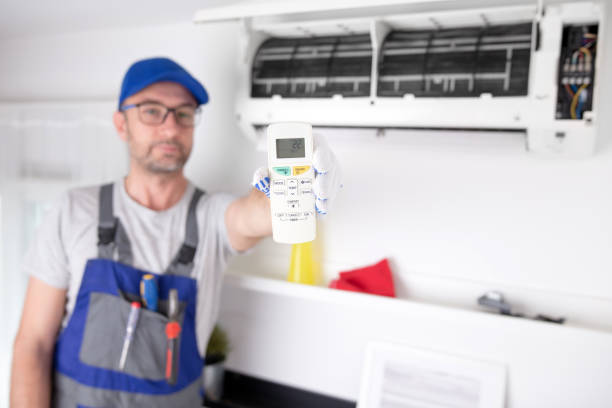 istock Service guy cleaning and maintaining air condition unit. 1494785517