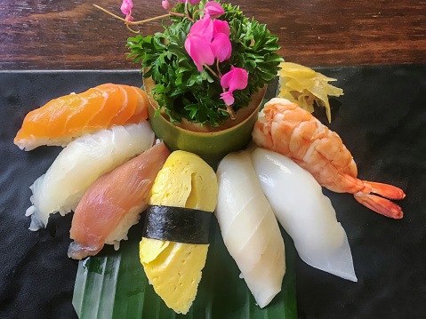 Close-up shot of variety sushi sashimi at Japanese restaurant.