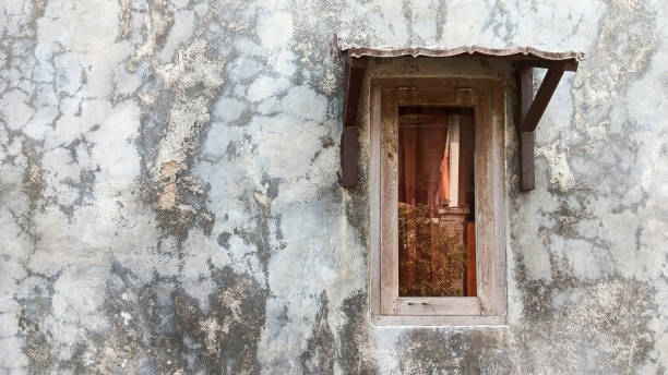 istock One window on the right side of the big wall 1494786459