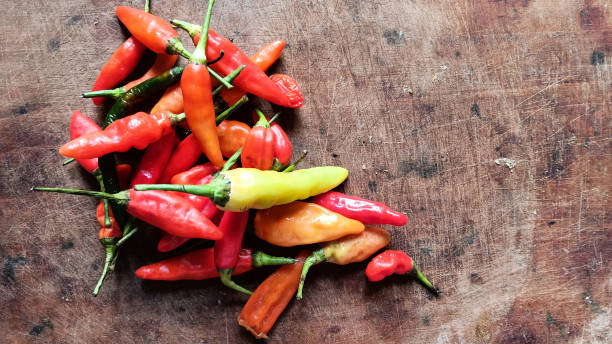 istock Short colorful chilies lying on the cutting board 1494786569