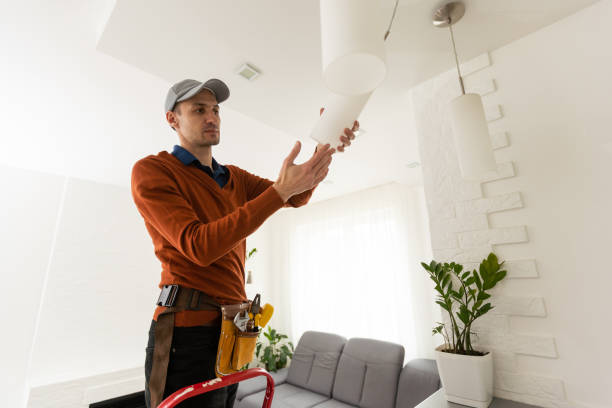 istock Electrician worker installation electric lamps light inside apartment. Construction decoration concept. 1494788457