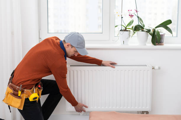 istock adjustment of heating radiator. temperature. 1494788564