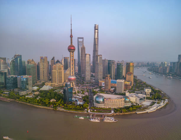 The drone aerial view of Lujiazui financial and trade zone at dusk, Pudong, Shanghai, China. Shanghai, China- April 20, 2023: The drone aerial view of Lujiazui financial and trade zone at dusk, Pudong, Shanghai, China. Lujiazui is the largest financial zone in mainland China. shanghai world financial center stock pictures, royalty-free photos & images