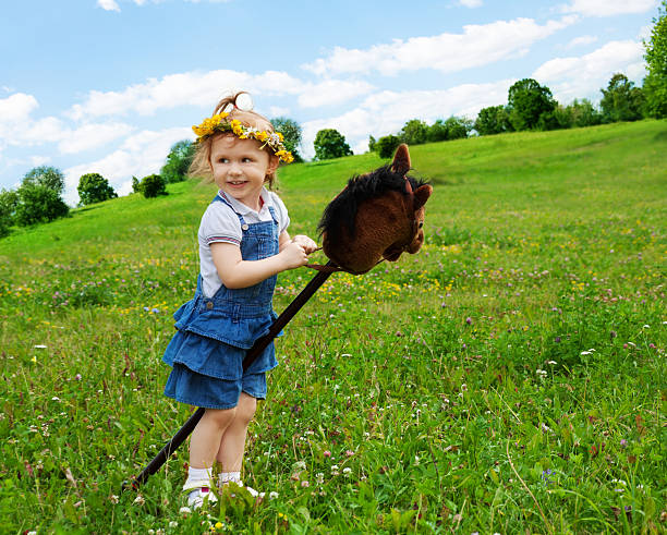 istock happy girl with horse stick 149478914